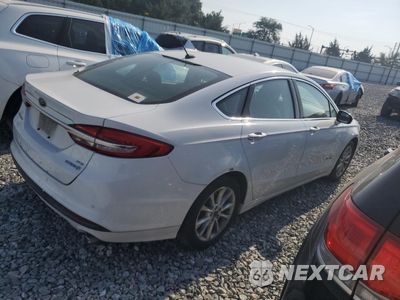 Trzecie zdjęcie samochodu z tyłu: 2017 FORD FUSION SE HYBRID VIN:3FA6P0LU7HR409571 - miniatura