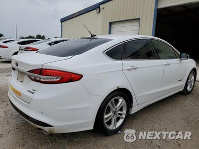 Trzecie zdjęcie samochodu z tyłu: 2018 FORD FUSION SE HYBRID VIN:3FA6P0LU2JR129806 - miniatura