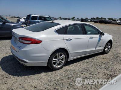 Trzecie zdjęcie samochodu z tyłu: 2018 FORD FUSION SE HYBRID VIN:3FA6P0LU1JR171559 - miniatura