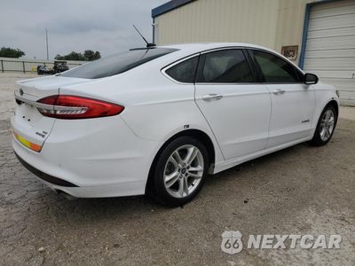 Trzecie zdjęcie samochodu z tyłu: 2018 FORD FUSION SE HYBRID VIN:3FA6P0LU6JR171816 - miniatura