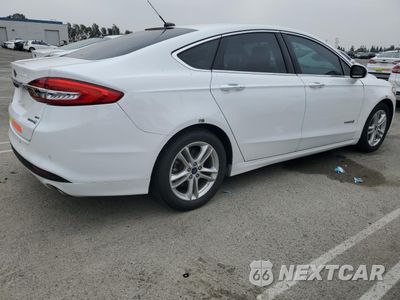 Trzecie zdjęcie samochodu z tyłu: 2018 FORD FUSION SE HYBRID VIN:3FA6P0LU9JR172149 - miniatura