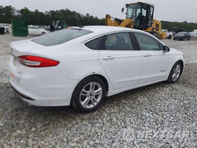 Trzecie zdjęcie samochodu z tyłu: 2018 FORD FUSION SE HYBRID VIN:3FA6P0LU8JR171770 - miniatura