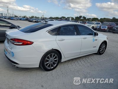 Trzecie zdjęcie samochodu z tyłu: 2017 FORD FUSION SE HYBRID VIN:3FA6P0LU9HR359563 - miniatura