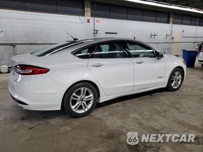 Trzecie zdjęcie samochodu z tyłu: 2018 FORD FUSION SE HYBRID VIN:3FA6P0LUXJR172077 - miniatura