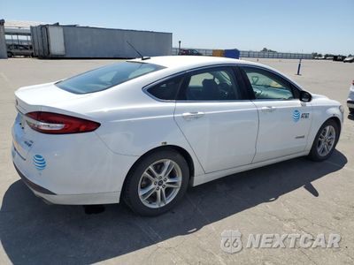 Trzecie zdjęcie samochodu z tyłu: 2018 FORD FUSION SE HYBRID VIN:3FA6P0LU3JR129832 - miniatura