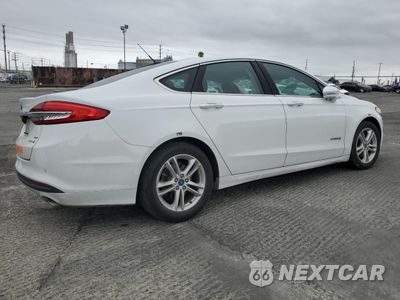 Trzecie zdjęcie samochodu z tyłu: 2018 FORD FUSION SE HYBRID VIN:3FA6P0LU1JR171903 - miniatura