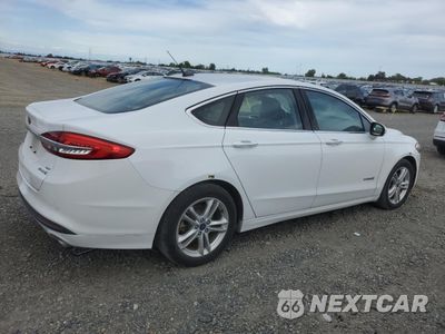 Trzecie zdjęcie samochodu z tyłu: 2018 FORD FUSION SE HYBRID VIN:3FA6P0LU2JR171537 - miniatura