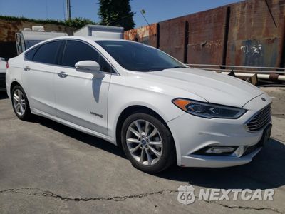 Czwarte zdjęcie samochodu z boku: 2017 FORD FUSION SE HYBRID VIN:3FA6P0LU9HR409281 - miniatura