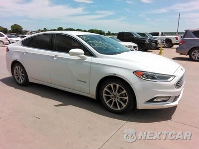 Czwarte zdjęcie samochodu z boku: 2017 FORD FUSION SE HYBRID VIN:3FA6P0LUZHR410061 - miniatura