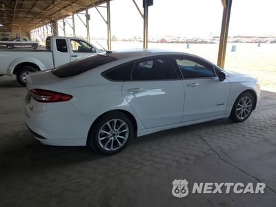 Trzecie zdjęcie samochodu z tyłu: 2017 FORD FUSION SE HYBRID VIN:3FA6P0LU1HR354955 - miniatura