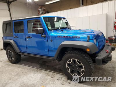 Czwarte zdjęcie samochodu z boku: 2015 JEEP WRANGLER UNLIMITED RUBICON VIN:1C4BJWFG1FL709704 - miniatura