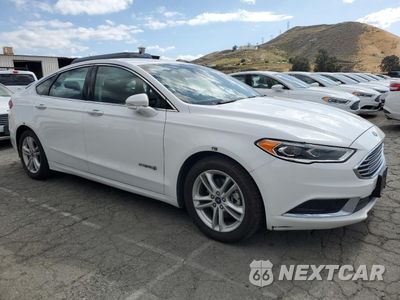 Czwarte zdjęcie samochodu z boku: 2018 FORD FUSION SE HYBRID VIN:3FA6P0LU1JR172145 - miniatura