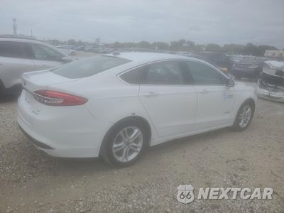 Trzecie zdjęcie samochodu z tyłu: 2018 FORD FUSION SE HYBRID VIN:3FA6P0LU3JR129880 - miniatura