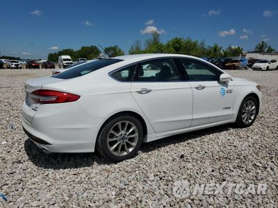 Trzecie zdjęcie samochodu z tyłu: 2017 FORD FUSION SE HYBRID VIN:3FA6P0LU0HR409072 - miniatura