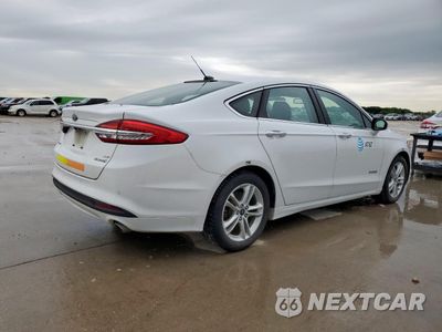 Trzecie zdjęcie samochodu z tyłu: 2018 FORD FUSION SE HYBRID VIN:3FA6P0LU1JR171934 - miniatura