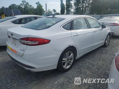 Trzecie zdjęcie samochodu z tyłu: 2018 FORD FUSION SE HYBRID VIN:3FA6P0LU7JR171906 - miniatura