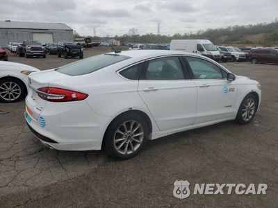 Trzecie zdjęcie samochodu z tyłu: 2017 FORD FUSION SE HYBRID VIN:3FA6P0LU9HR410060 - miniatura