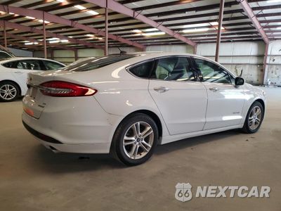Trzecie zdjęcie samochodu z tyłu: 2018 FORD FUSION SE HYBRID VIN:3FA6P0LU3JR287006 - miniatura