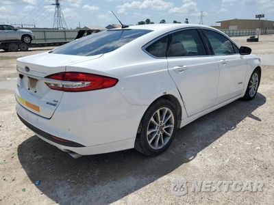 Trzecie zdjęcie samochodu z tyłu: 2017 FORD FUSION SE HYBRID VIN:3FA6P0LU3HR409003 - miniatura