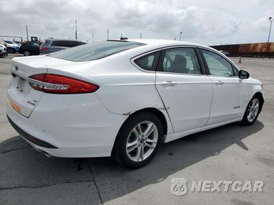 Trzecie zdjęcie samochodu z tyłu: 2018 FORD FUSION SE HYBRID VIN:3FA6P0LU1JR278725 - miniatura