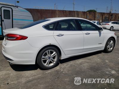 Trzecie zdjęcie samochodu z tyłu: 2018 FORD FUSION SE HYBRID VIN:3FA6P0LU1JR171531 - miniatura