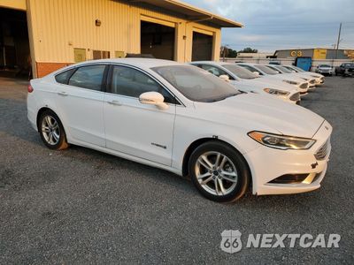 Czwarte zdjęcie samochodu z boku: 2018 FORD FUSION SE HYBRID VIN:3FA6P0LU7JR163501 - miniatura