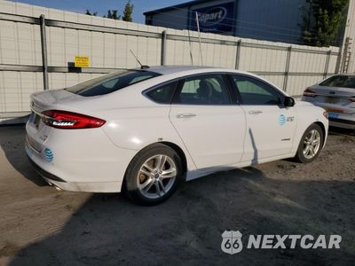 Trzecie zdjęcie samochodu z tyłu: 2018 FORD FUSION SE HYBRID VIN:3FA6P0LU2JR171781 - miniatura