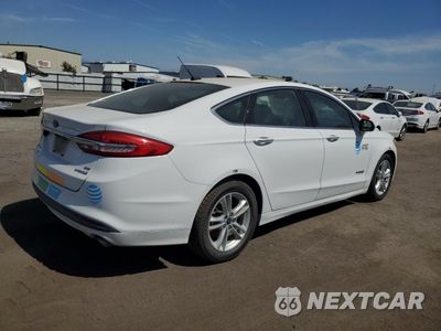 Trzecie zdjęcie samochodu z tyłu: 2018 FORD FUSION SE HYBRID VIN:3FA6P0LU5JR163500 - miniatura