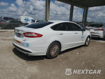 Trzecie zdjęcie samochodu z tyłu: 2016 FORD FUSION SE HYBRID VIN:3FA6P0LU6GR208338 - miniatura