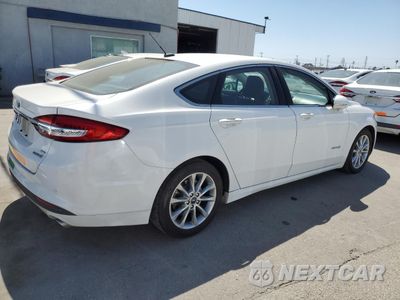 Trzecie zdjęcie samochodu z tyłu: 2017 FORD FUSION SE HYBRID VIN:3FA6P0LU1HR408917 - miniatura