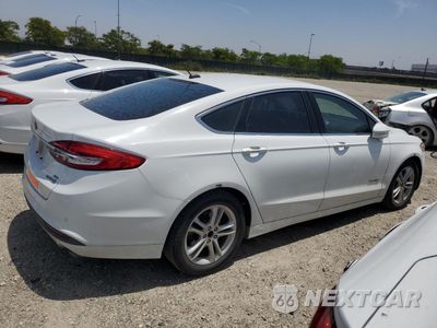 Trzecie zdjęcie samochodu z tyłu: 2018 FORD FUSION SE HYBRID VIN:3FA6P0LU4JR129838 - miniatura