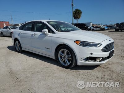 Czwarte zdjęcie samochodu z boku: 2018 FORD FUSION SE HYBRID VIN:3FA6P0LU2JR163518 - miniatura