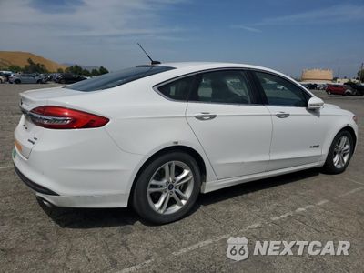 Trzecie zdjęcie samochodu z tyłu: 2018 FORD FUSION SE HYBRID VIN:3FA6P0LU1JR172114 - miniatura