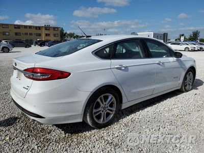 Trzecie zdjęcie samochodu z tyłu: 2018 FORD FUSION SE HYBRID VIN:3FA6P0LU4JR172026 - miniatura