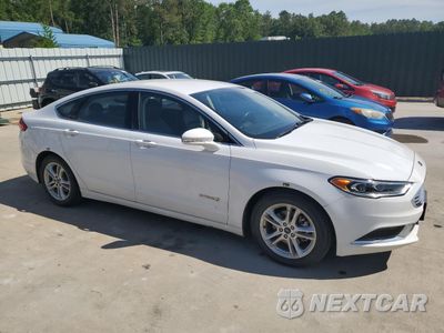 Czwarte zdjęcie samochodu z boku: 2018 FORD FUSION SE HYBRID VIN:3FA6P0LUXJR171768 - miniatura