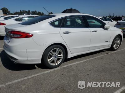 Trzecie zdjęcie samochodu z tyłu: 2018 FORD FUSION SE HYBRID VIN:3FA6P0LU0JR118867 - miniatura