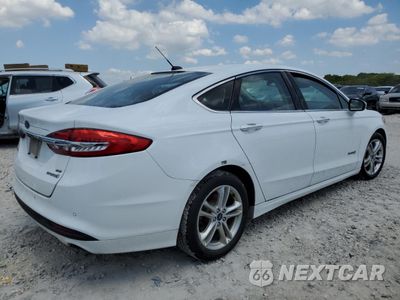 Trzecie zdjęcie samochodu z tyłu: 2018 FORD FUSION SE HYBRID VIN:3FA6P0LU9JR163516 - miniatura