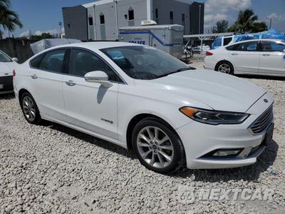 Czwarte zdjęcie samochodu z boku: 2017 FORD FUSION SE HYBRID VIN:3FA6P0LU5HR359639 - miniatura