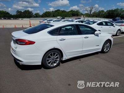 Trzecie zdjęcie samochodu z tyłu: 2017 FORD FUSION SE HYBRID VIN:3FA6P0LU5HR409245 - miniatura