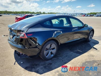 Trzecie zdjęcie samochodu z tyłu: 2022 TESLA MODEL 3 VIN:5YJ3E1EA5NF251868 - miniatura