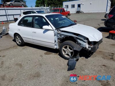 Czwarte zdjęcie samochodu z boku: 2002 TOYOTA COROLLA LE VIN:1NXBR12E32Z643205 - miniatura
