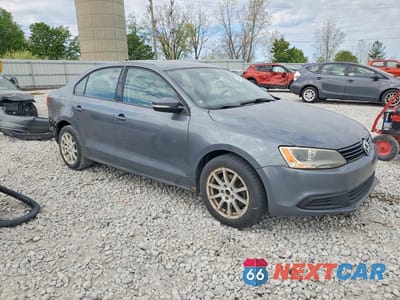 Czwarte zdjęcie samochodu z boku: 2011 VOLKSWAGEN JETTA SE VIN:3VWDX7AJ7BM387396 - miniatura