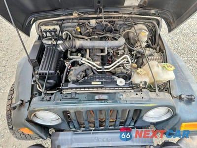 Zdjęcie 12 z 13 samochodu: 2004 JEEP WRANGLER / TJ SPORT VIN:1J4FA49S64P747788 - miniatura