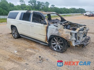 Czwarte zdjęcie samochodu z boku: 2015 CHEVROLET SUBURBAN C1500 LTZ VIN:1GNSCKKC6FR682798 - miniatura