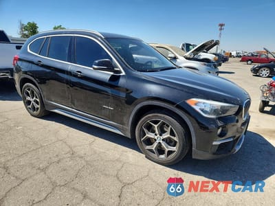 Czwarte zdjęcie samochodu z boku: 2018 BMW X1 XDRIVE28I VIN:WBXHT3C38J5K28093 - miniatura