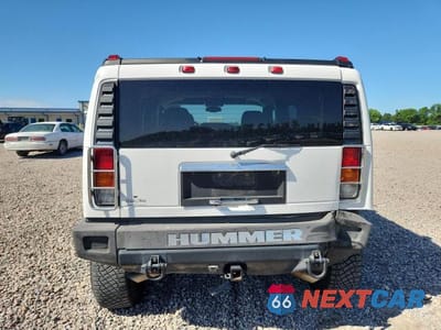 Zdjęcie 6 z 13 samochodu: 2004 HUMMER H2 VIN:5GRGN23U44H122571 - miniatura