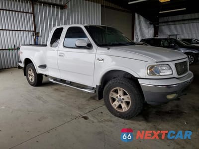 Czwarte zdjęcie samochodu z boku: 2002 FORD F150 VIN:2FTRX08L32CA61890 - miniatura