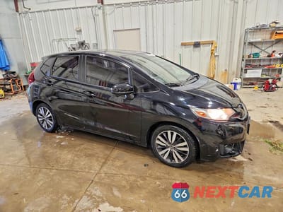 Czwarte zdjęcie samochodu z boku: 2016 HONDA FIT EX VIN:JHMGK5H71GX046010 - miniatura
