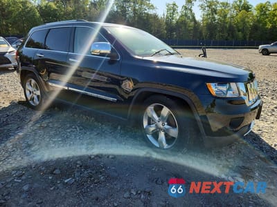 Czwarte zdjęcie samochodu z boku: 2013 JEEP GRAND CHEROKEE OVERLAND VIN:1C4RJFCT9DC635610 - miniatura