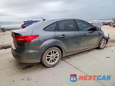 Trzecie zdjęcie samochodu z tyłu: 2016 FORD FOCUS VIN:1FADP3F27GL391556 - miniatura